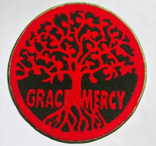 Custom Grace and Mercy circular chenille logo patch with raised red pile